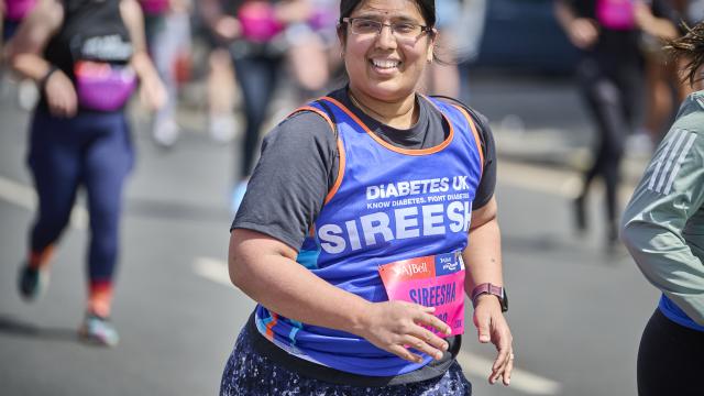 Female runner smiling at the camera